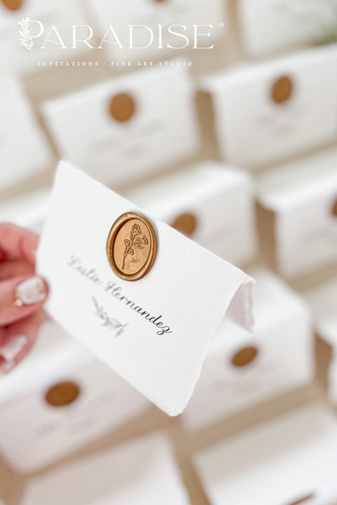 Elevate your wedding or event with our handmade paper place cards, crafted from luxurious cotton rag paper and finished with naturally torn deckled edges. Each card is adorned with a warm copper wax seal and elegant calligraphy, creating a timeless, fine-art detail that enhances any tablescape. Designed to bring organic texture, charm, and sophistication, these artisan place cards make your seating display unforgettable.