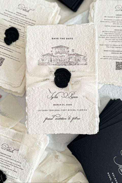 Announce your wedding with timeless artistry through our handmade paper Save the Date cards, featuring a custom hand-drawn sketch of your wedding venue. Each card is crafted on luxury 100% cotton handmade paper with natural deckled edges, wrapped in delicate silk ribbon, and finished with a black wax seal - a true embodiment of fine-art romance and sophistication.