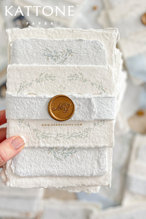 Embrace bohemian charm and natural elegance with the Alcina boho rustic stationery sets. Each handmade wedding invitation is a beautiful work of art, featuring luxurious cotton rag paper with a romantic deckle edge. To complete the bohemian feel, every suite is embellished with a delicate tassel, creating a uniquely personal and tactile experience for your guests. The combination of rustic textures and charming details makes this collection perfect for a relaxed and romantic celebration.