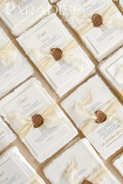 This exquisite wedding invitations suite offers a blend of natural elegance and personalized artistry. Perfect for an ivory classy wedding, each invite features a bespoke floral custom monogram, created just for you. As an eco friendly wedding invites choice, this stationery is both beautiful and sustainable, making it a thoughtful and sophisticated way to set the tone for your special day.