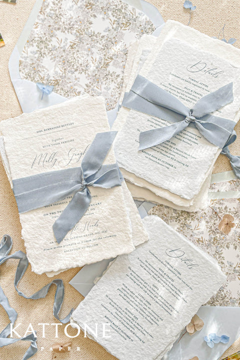 This exquisite handmade cotton paper wedding invitations suite offers a blend of natural elegance and personalized artistry. Each invite is a work of fine art, with a beautiful custom calligraphy design created just for you. The luxurious, textured paper and romantic typography create a truly memorable and heartfelt stationery set that will be cherished by your guests long after your special day.