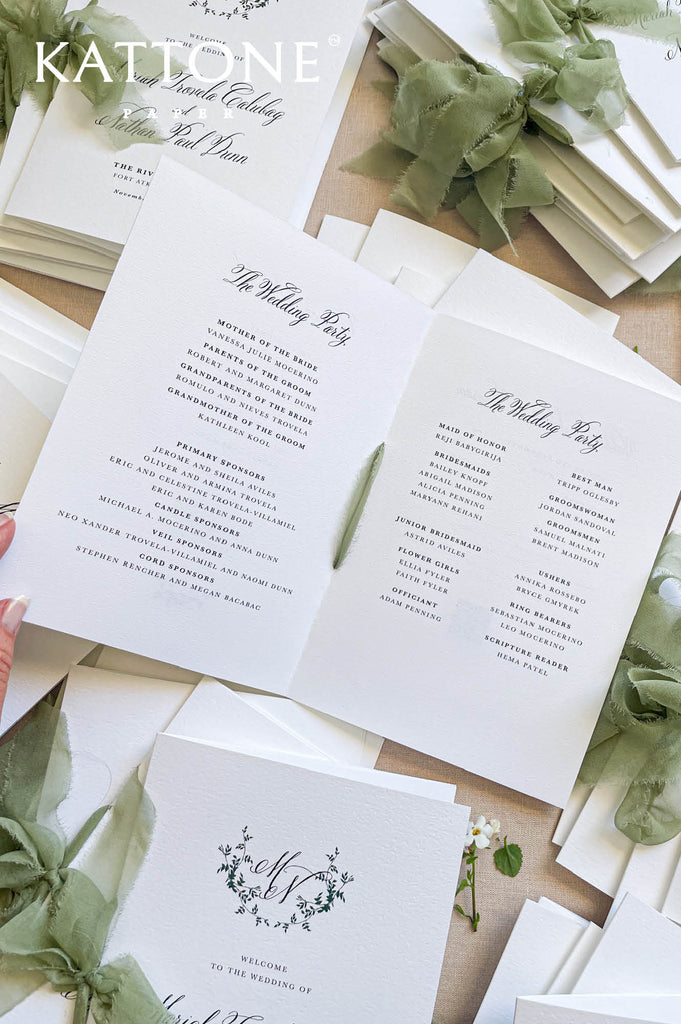 Wedding ceremony program booklet featuring botanical monogram and elegant typography.