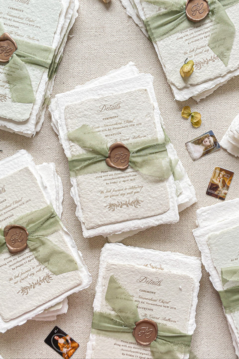 Create a memorable first impression with our stunning Wedding Invitation Sets, expertly crafted from handmade paper. Each invitation is elegantly assembled with luxurious silk ribbons and adorned with golden wax seals, providing a unique touch to your special day. Our craftsmanship ensures every detail is perfect for your celebration. Place a deposit today to secure your personalized design and make your wedding invitations truly unforgettable. Embrace elegance and charm with our bespoke creations!