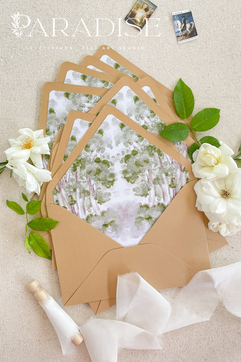 Fine art wedding stationery featuring envelopes with watercolor envelope liners and romantic floral styling.