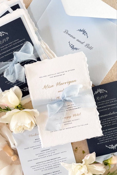 Elegant, timeless, and entirely handmade - this blue fine art wedding invitation suite was created for couples who want their stationery to feel as meaningful and beautiful as their love story. Each invitation is printed on luxurious deckled-edge cotton paper, hand-torn for that soft, organic texture, and wrapped in a dusty blue chiffon ribbon that adds a romantic finishing touch.