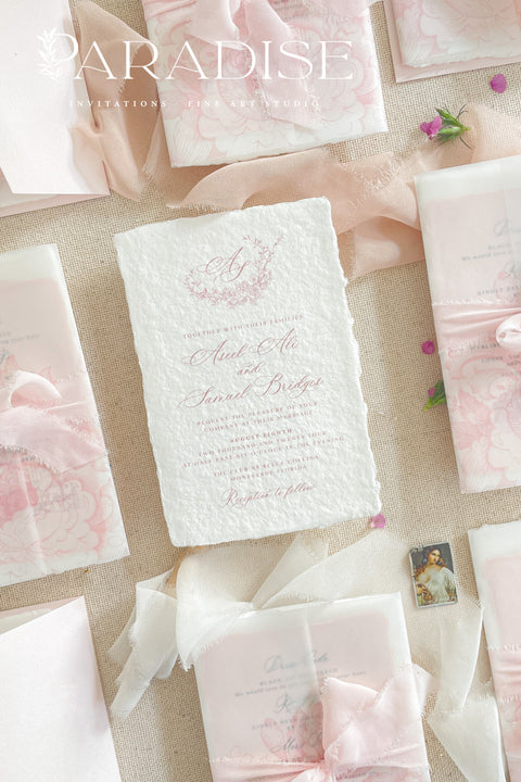 Announce your special day with the effortless, romantic charm of these handmade paper wedding invitations. Crafted for a boho wedding, this suite captures the free-spirited beauty of the season. Each invite is printed on soft and luxurious cotton paper, providing a unique, tactile experience for your guests. The light, airy design and premium paper are the perfect combination for a memorable summer wedding.