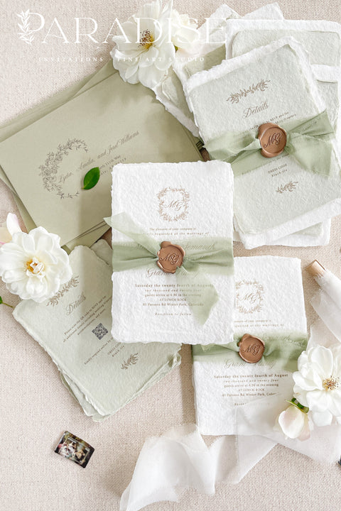 This exquisite wedding invitations suite offers a blend of natural elegance and modern romance. Perfect for a green summer wedding, these invitations are printed on luxurious handmade paper, which provides a rich, tactile feel. The elegant modern calligraphy design adds a touch of contemporary sophistication, setting a fresh and heartfelt tone for your special day.