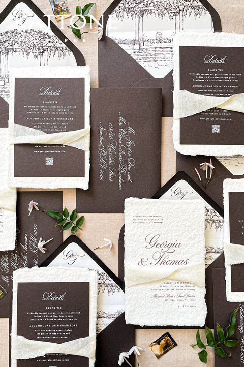 Luxury wedding invitation with charcoal envelope and illustrated envelope liner, black and white architectural artwork.