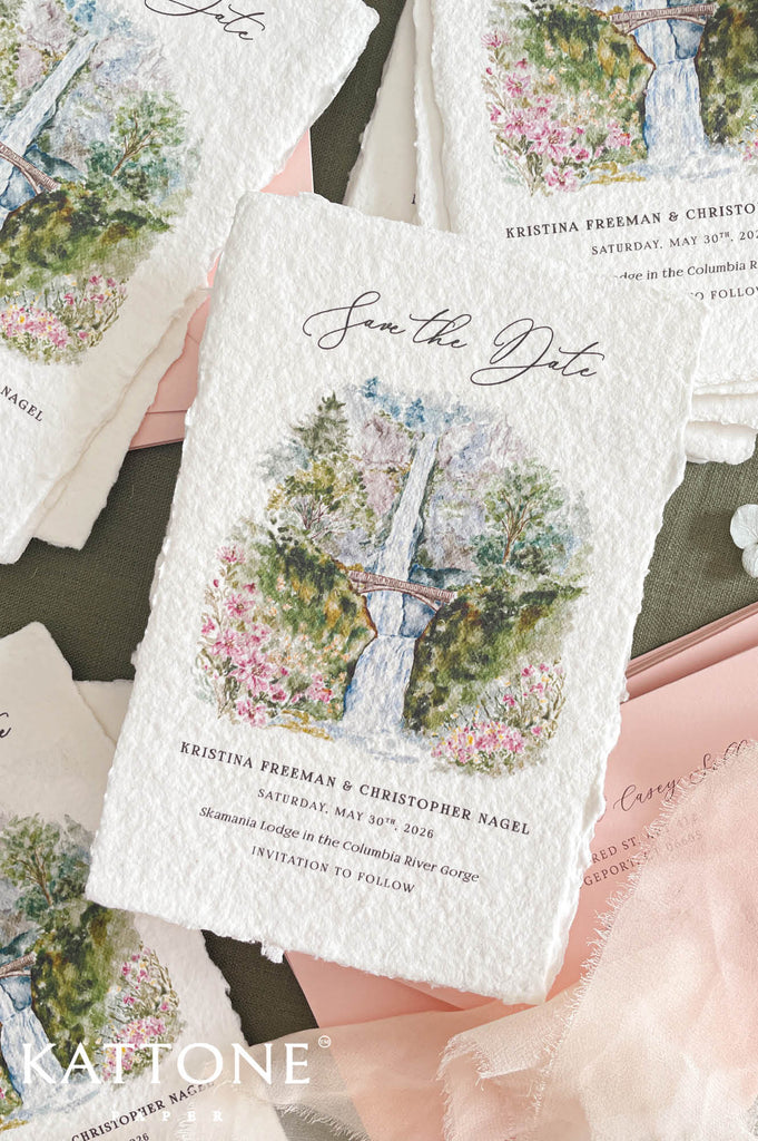 Detailed watercolor painting of waterfall, stone bridge and blooming florals in soft pastel tones printed on fine art cotton paper invitation.