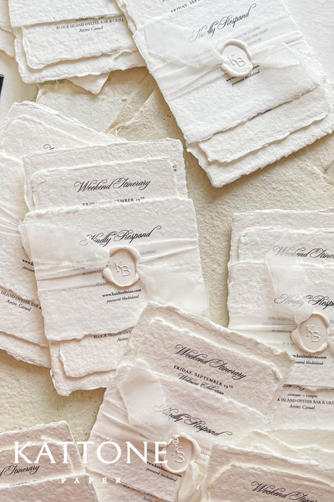 Timeless, refined, and elegantly understated - these handmade paper wedding invitations embody the essence of fine art craftsmanship. Printed on luxury cotton handmade paper with naturally deckled edges, each invitation feels soft, organic, and beautifully textured, creating a sense of warmth and authenticity from the very first touch. Each suite is wrapped in a silk ribbon and finished with wax seal monogram, adding a bespoke touch that symbolizes intimacy and attention to detail.
