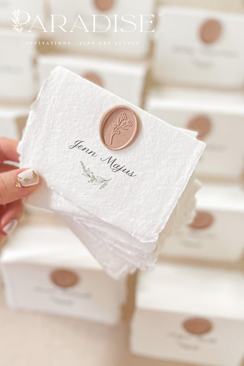Add refined elegance to your event with our handmade paper place cards, crafted from luxurious cotton rag paper and finished with soft deckled edges. Each card features elegant calligraphy paired with a blush wax seal, creating a timeless and romantic detail for weddings, dinners, and fine-art celebrations. These artisan place cards bring texture, charm, and sophistication to any tablescape.