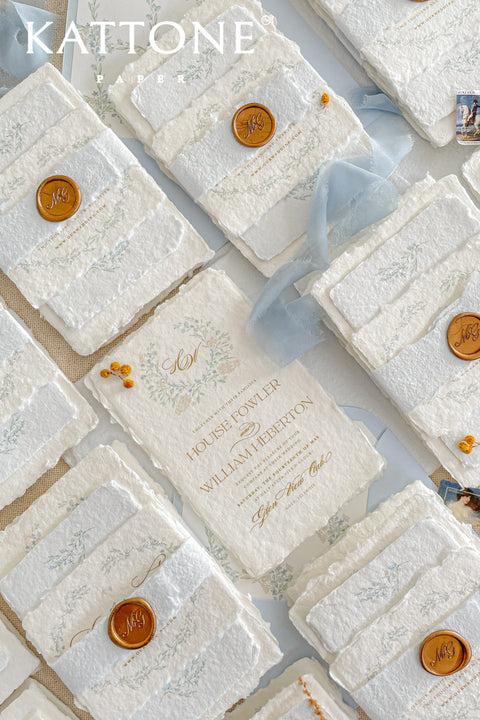 Embrace bohemian charm and natural elegance with the Alcina boho rustic stationery sets. Each handmade wedding invitation is a beautiful work of art, featuring luxurious cotton rag paper with a romantic deckle edge. To complete the bohemian feel, every suite is embellished with a delicate tassel, creating a uniquely personal and tactile experience for your guests. The combination of rustic textures and charming details makes this collection perfect for a relaxed and romantic celebration.