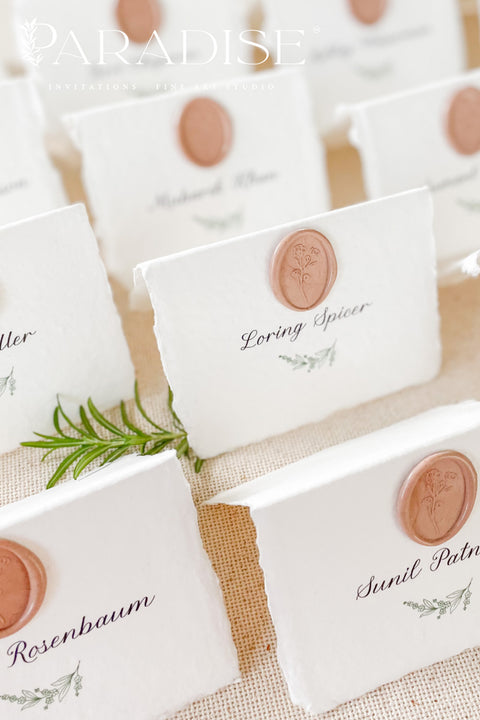 Add refined elegance to your event with our handmade paper place cards, crafted from luxurious cotton rag paper and finished with soft deckled edges. Each card features elegant calligraphy paired with a blush wax seal, creating a timeless and romantic detail for weddings, dinners, and fine-art celebrations. These artisan place cards bring texture, charm, and sophistication to any tablescape.