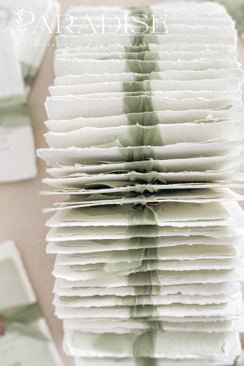 This exquisite wedding invitations suite offers a blend of natural elegance and modern romance. Perfect for a green summer wedding, these invitations are printed on luxurious handmade paper, which provides a rich, tactile feel. The elegant modern calligraphy design adds a touch of contemporary sophistication, setting a fresh and heartfelt tone for your special day.