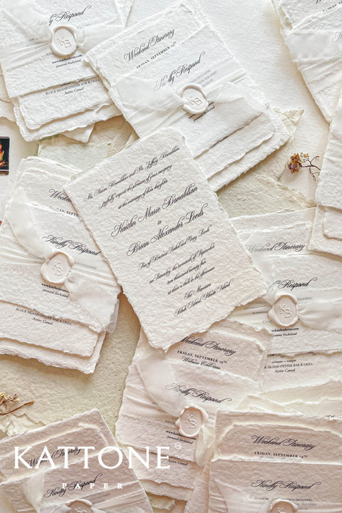 Timeless, refined, and elegantly understated - these handmade paper wedding invitations embody the essence of fine art craftsmanship. Printed on luxury cotton handmade paper with naturally deckled edges, each invitation feels soft, organic, and beautifully textured, creating a sense of warmth and authenticity from the very first touch. Each suite is wrapped in a silk ribbon and finished with wax seal monogram, adding a bespoke touch that symbolizes intimacy and attention to detail.