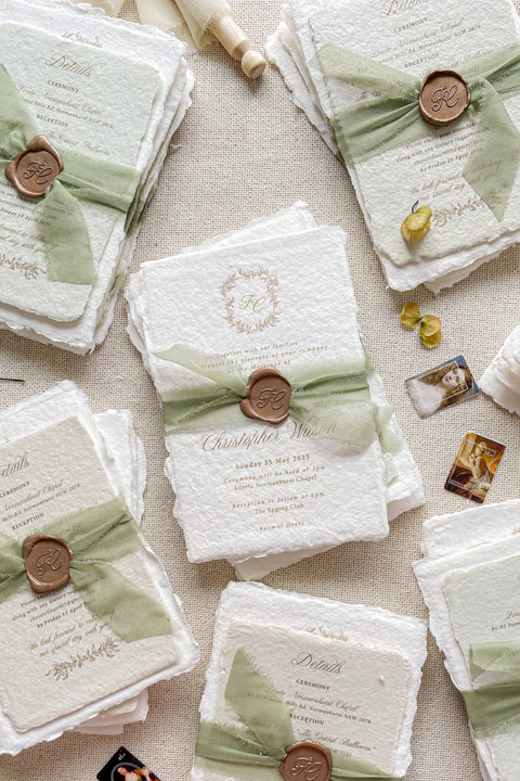 Create a memorable first impression with our stunning Wedding Invitation Sets, expertly crafted from handmade paper. Each invitation is elegantly assembled with luxurious silk ribbons and adorned with golden wax seals, providing a unique touch to your special day. Our craftsmanship ensures every detail is perfect for your celebration. Place a deposit today to secure your personalized design and make your wedding invitations truly unforgettable. Embrace elegance and charm with our bespoke creations!