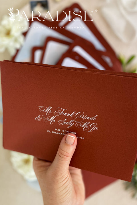 Red wedding envelopes with printed guest addresses and illustrated envelope liners, crafted from premium paper for luxury fine art invitation suites.