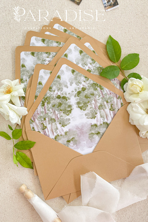 Fine art wedding stationery featuring envelopes with watercolor envelope liners and romantic floral styling.