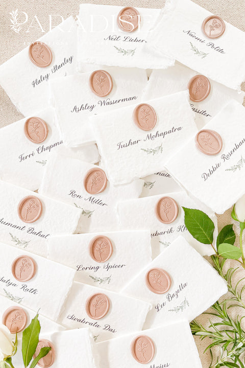 Add refined elegance to your event with our handmade paper place cards, crafted from luxurious cotton rag paper and finished with soft deckled edges. Each card features elegant calligraphy paired with a blush wax seal, creating a timeless and romantic detail for weddings, dinners, and fine-art celebrations. These artisan place cards bring texture, charm, and sophistication to any tablescape.