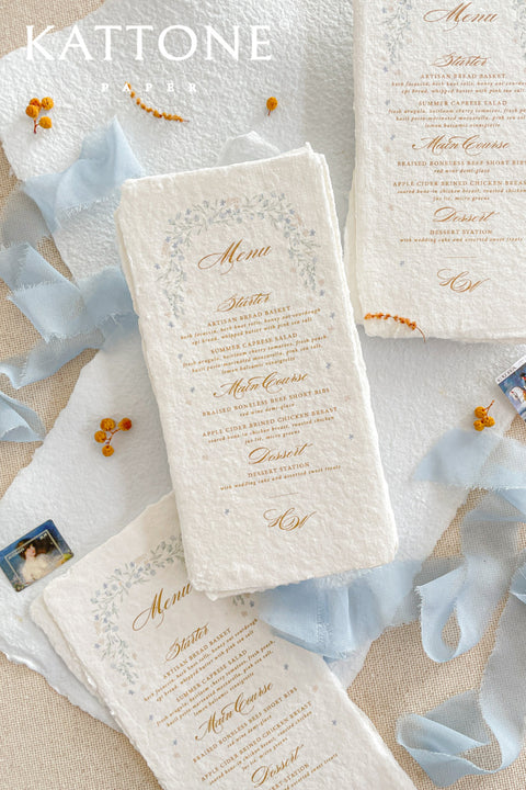 Refined and timeless, our handmade paper menus bring a touch of fine-art elegance to your wedding tablescape. Crafted from 100% cotton paper with natural deckled edges, each piece features a soft, tactile texture that perfectly complements romantic and elevated wedding themes.