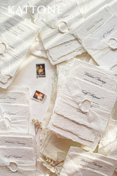 Timeless, refined, and elegantly understated - these handmade paper wedding invitations embody the essence of fine art craftsmanship. Printed on luxury cotton handmade paper with naturally deckled edges, each invitation feels soft, organic, and beautifully textured, creating a sense of warmth and authenticity from the very first touch. Each suite is wrapped in a silk ribbon and finished with wax seal monogram, adding a bespoke touch that symbolizes intimacy and attention to detail.