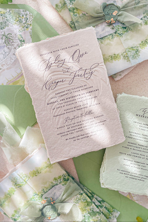 Announce your marriage with an invitation suite that is a work of fine art. These romantic garden wedding invites feature a bespoke custom venue illustration watercolor, hand-painted to capture the unique charm of your location. A subtle and sophisticated touch is added with blind embossing, creating a raised texture of delicate botanical details that adds to the luxurious feel. The combination of artistry and texture makes this a truly special and memorable romantic suite.