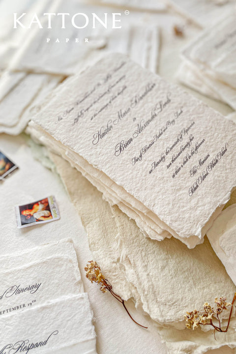 Timeless, refined, and elegantly understated - these handmade paper wedding invitations embody the essence of fine art craftsmanship. Printed on luxury cotton handmade paper with naturally deckled edges, each invitation feels soft, organic, and beautifully textured, creating a sense of warmth and authenticity from the very first touch. Each suite is wrapped in a silk ribbon and finished with wax seal monogram, adding a bespoke touch that symbolizes intimacy and attention to detail.