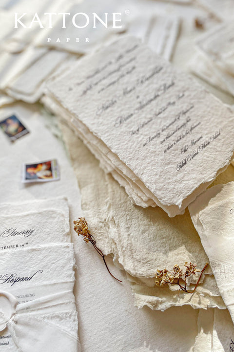 Timeless, refined, and elegantly understated - these handmade paper wedding invitations embody the essence of fine art craftsmanship. Printed on luxury cotton handmade paper with naturally deckled edges, each invitation feels soft, organic, and beautifully textured, creating a sense of warmth and authenticity from the very first touch. Each suite is wrapped in a silk ribbon and finished with wax seal monogram, adding a bespoke touch that symbolizes intimacy and attention to detail.