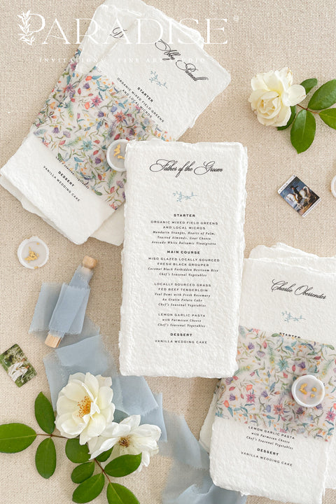 Add a touch of botanical beauty and fine art elegance to your event with our handmade paper wedding menus, crafted from 100% cotton rag paper with delicately torn deckled edges. Each menu features a vibrant floral vellum wrap paired with a soft silk ribbon and wax seal, creating an exquisite balance between organic texture and romantic detail. The minimalist typography allows the floral design to shine, making these menus perfect for garden weddings, spring celebrations and outdoor receptions.