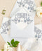 Luxury baby blue envelopes featuring watercolor liners, arranged with floral details for elegant wedding invitations.