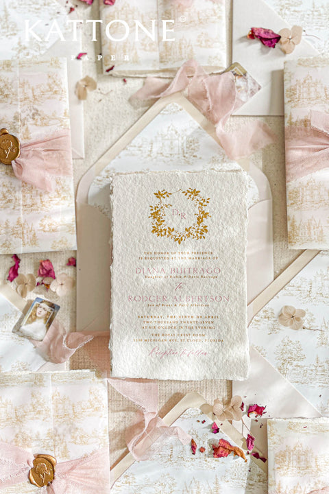 This exquisite wedding invitations suite offers a blend of timeless charm and personalized artistry. The suite features beautiful pretty stationery enclosed in a translucent custom toile de jouy vellum jacket, printed with your unique custom crest monogram. The result is a truly elegant and memorable keepsake that sets a romantic and intimate tone for your special day.