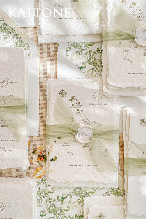 This handmade paper wedding invitation suite captures the essence of natural romance and bespoke craftsmanship. Printed on luxury cotton paper with beautifully deckled edges, each invitation is a tactile work of art that feels timeless and refined. The suite features a custom hand-drawn map, turning your wedding location into a cherished keepsake that guides guests with personal artistry.