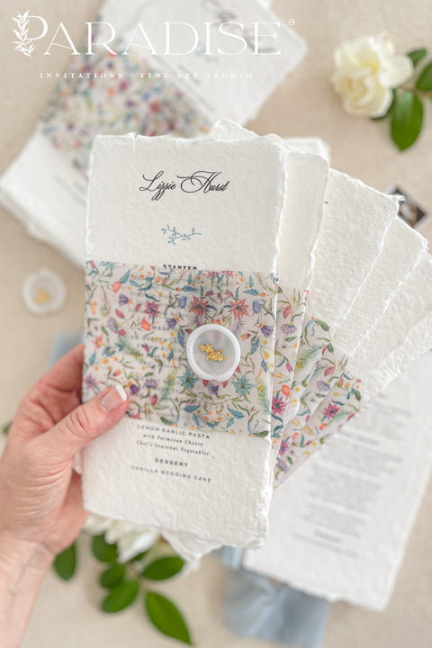 Add a touch of botanical beauty and fine art elegance to your event with our handmade paper wedding menus, crafted from 100% cotton rag paper with delicately torn deckled edges. Each menu features a vibrant floral vellum wrap paired with a soft silk ribbon and wax seal, creating an exquisite balance between organic texture and romantic detail. The minimalist typography allows the floral design to shine, making these menus perfect for garden weddings, spring celebrations and outdoor receptions.