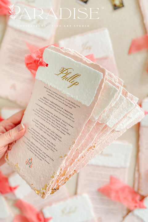 Bring a burst of color and elegance to your table setting with our colored handmade paper wedding menus, crafted from luxurious 100% cotton rag paper. These exquisite menus feature soft blush-pink tones, deckled edges, and gold foil calligraphy, creating a romantic and elevated aesthetic for any celebration. Each menu is finished with a vibrant coral silk ribbon and personalized name tag, combining artistry and function by doubling as both a menu and a place card. 