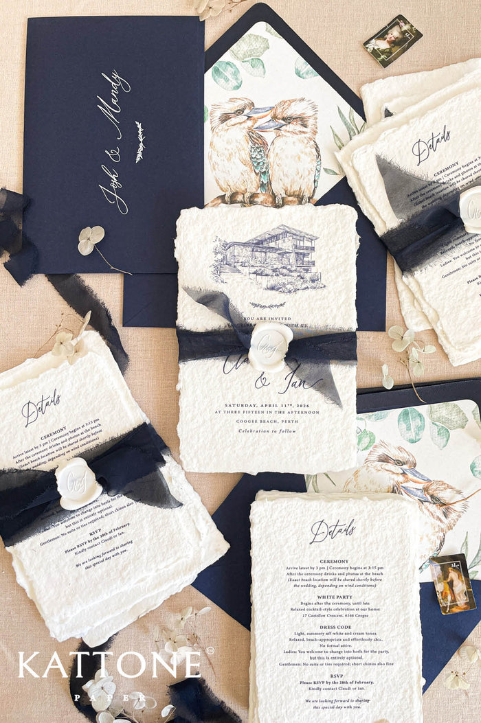 Luxury handmade cotton paper wedding invitation with deckled edges and venue illustration, styled with black silk ribbon, wax seal and navy envelopes with illustrated inserts.