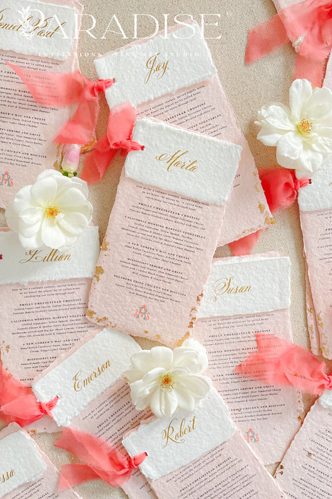 Bring a burst of color and elegance to your table setting with our colored handmade paper wedding menus, crafted from luxurious 100% cotton rag paper. These exquisite menus feature soft blush-pink tones, deckled edges, and gold foil calligraphy, creating a romantic and elevated aesthetic for any celebration. Each menu is finished with a vibrant coral silk ribbon and personalized name tag, combining artistry and function by doubling as both a menu and a place card. 