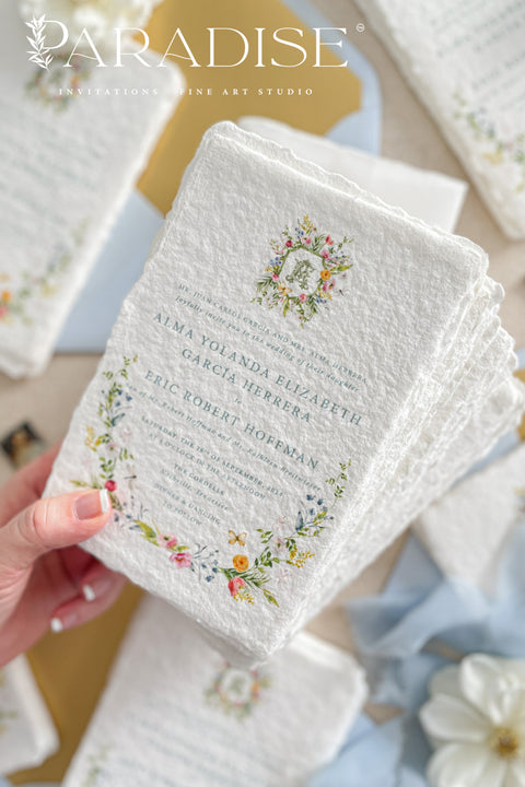 This exquisite wedding invitation set offers a blend of timeless charm and whimsical artistry. Each suite is printed on a luxurious handmade paper from our cotton rag suite, providing a rich, tactile feel. A delicate tassel is included with each invite, adding a playful pop of color and charm. The beautiful watercolor floral invites create a stunning and romantic preview of your special day.