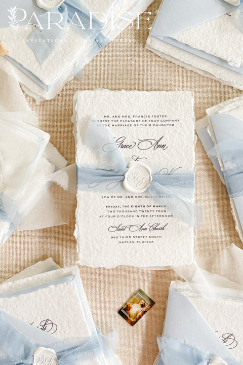 Announce your special day with a touch of coastal elegance and bohemian chic with this unique beach wedding invitations suite. Perfect for a seaside celebration, this elegant wedding stationery set combines classic details with a relaxed feel. Each invite is finished with a personalized wax seal, adding a luxurious, tactile element that makes a memorable first impression.