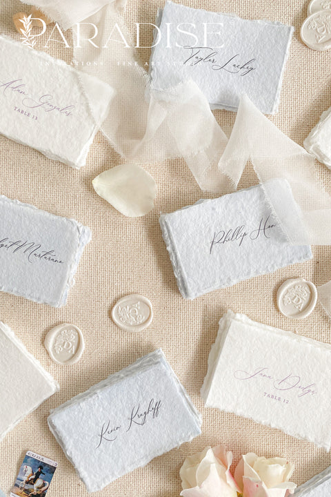 Add a touch of fine-art elegance to your celebration with our colored handmade paper place cards, crafted from premium cotton rag paper and finished with soft, natural deckled edges. Each card features beautifully flowing calligraphy and comes in a curated palette of soft, romantic hues - perfect for weddings, dinner parties, bridal showers, or luxury events. Designed to elevate any tablescape, these artisanal place cards bring warmth, texture, and timeless beauty to your seating arrangements.