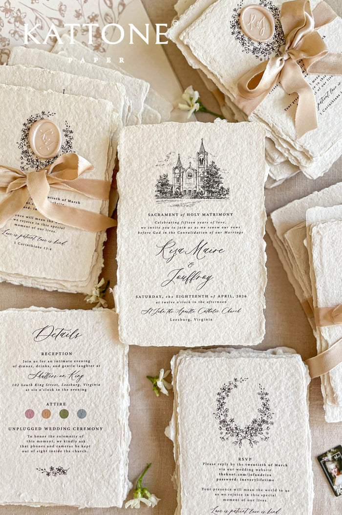 Handmade paper wedding invitations with custom church illustration, deckle edges, silk ribbon, and wax seal details.