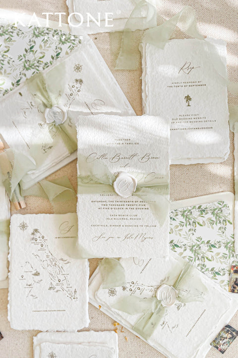 This handmade paper wedding invitation suite captures the essence of natural romance and bespoke craftsmanship. Printed on luxury cotton paper with beautifully deckled edges, each invitation is a tactile work of art that feels timeless and refined. The suite features a custom hand-drawn map, turning your wedding location into a cherished keepsake that guides guests with personal artistry.
