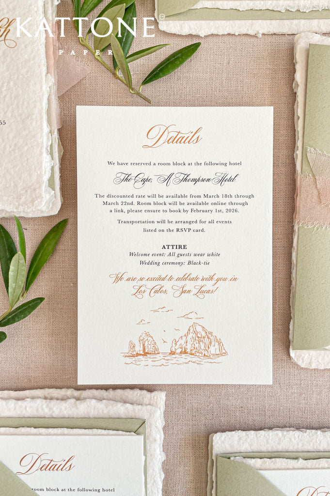 Flat lay of luxury wedding invitation suite with sage green envelopes, blush silk ribbon, and wax seal