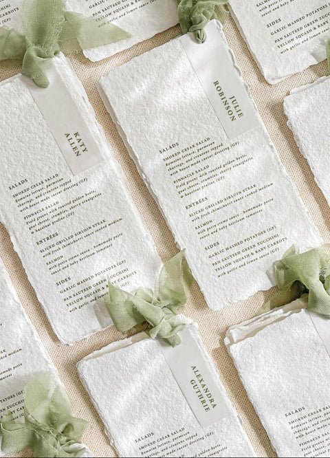 Add an ethereal touch to your wedding tables with our handmade paper menus with silk ribbons, crafted on luxury cotton paper with naturally deckled edges. Each piece features soft, hand-dyed silk chiffon ribbons and minimalist typography, blending refined simplicity with organic beauty. Perfect for romantic, fine-art, or garden weddings, these menus exude timeless charm and artisanal craftsmanship, setting the tone for a sophisticated celebration.