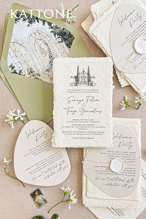 Handmade paper wedding invitations with a custom watercolor wedding venue illustration, deckle edges, and elegant typography.