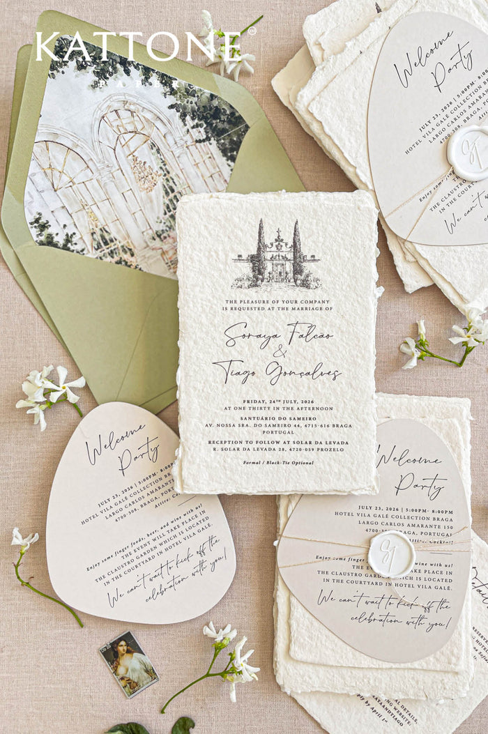 Handmade paper wedding invitations with a custom watercolor wedding venue illustration, deckle edges, and elegant typography.