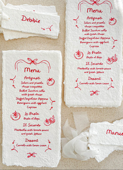 Infuse your tablescape with joyful artistry through our handmade paper menus with whimsical icons - a charming fusion of playfulness and elegance. Each piece is crafted on luxury cotton paper with soft deckled edges and illustrated with hand-drawn food and floral motifs in vivid ink. Perfect for Italian, rustic, or destination weddings, these menus bring warmth, creativity, and personality to your reception setting.