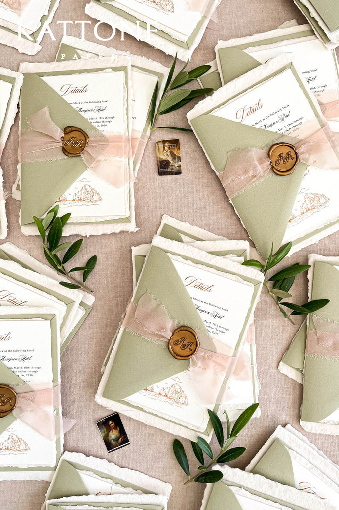Complete luxury wedding invitation suite with handmade paper, sage envelopes, and romantic styling