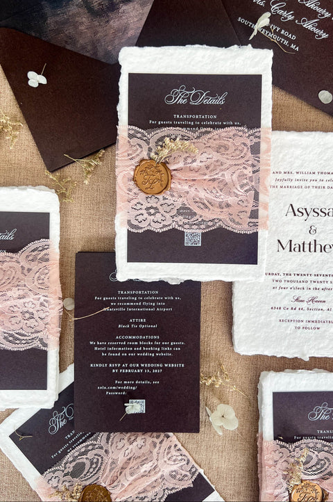 A styled flat-lay of Kattone Paper wedding stationery featuring dark brown and white textured paper, delicate rose gold lace overlays, vintage-style wax seals, and twine details on a linen background.