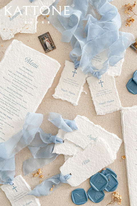 Celebrate your special occasion with our handmade paper place cards, crafted from luxurious cotton rag paper and finished with naturally torn deckled edges. Each card features soft blue lettering that pairs beautifully with baptism, christening, baby shower, and fine-art event themes. With their artisanal texture and elegant simplicity, these place cards add meaning, refinement, and timeless beauty to your table setting.
