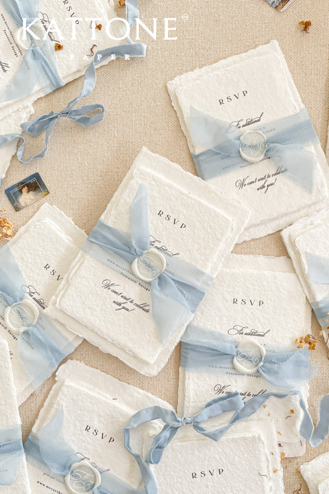 Announce your special day with understated elegance and personal charm. This earthen neutral wedding stationery collection is crafted to celebrate your love story with a refined, organic feel. Each invitation is a personalised handmade invite, featuring your unique details on our premium, artisan paper. The soft, neutral tones create a timeless and tranquil aesthetic, perfectly complemented by the gentle hue of the "Light Sky" accent color.